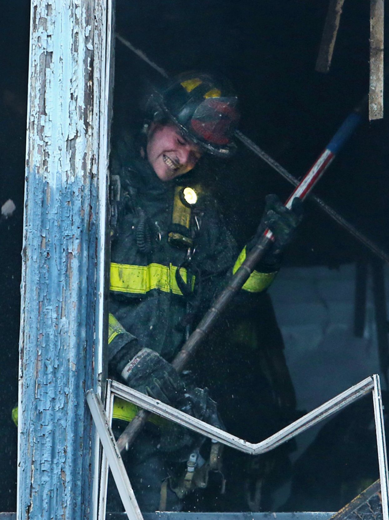 Firefighters battle a smoky fire on Martin Luther King